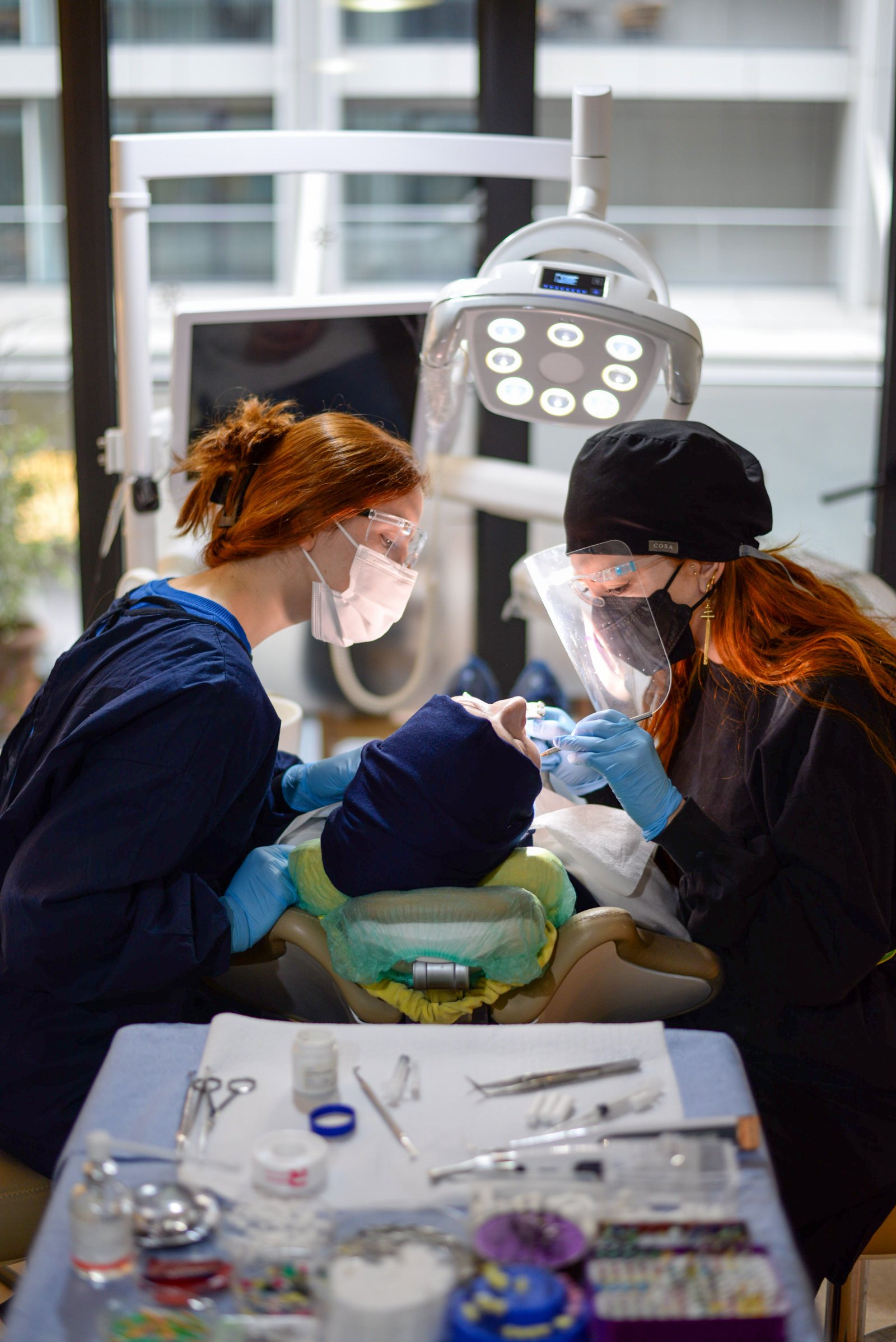 Dental clinic team treating a patient