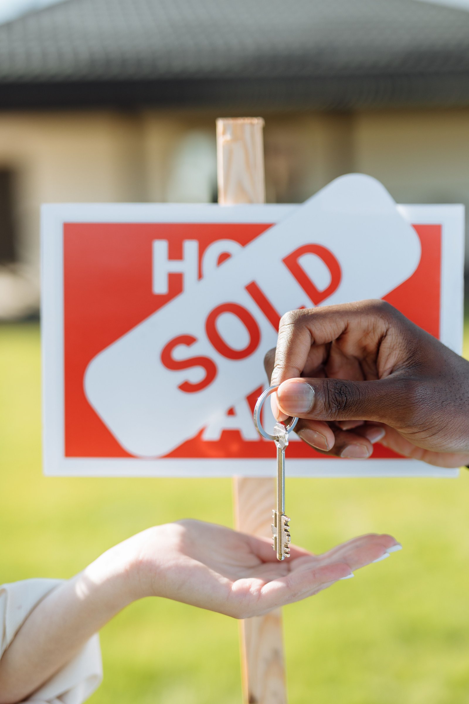 Real estate sold sign with keys